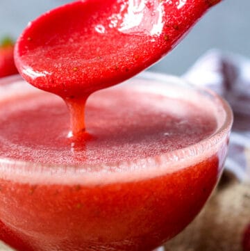 fresh syrup dripping from red spoon