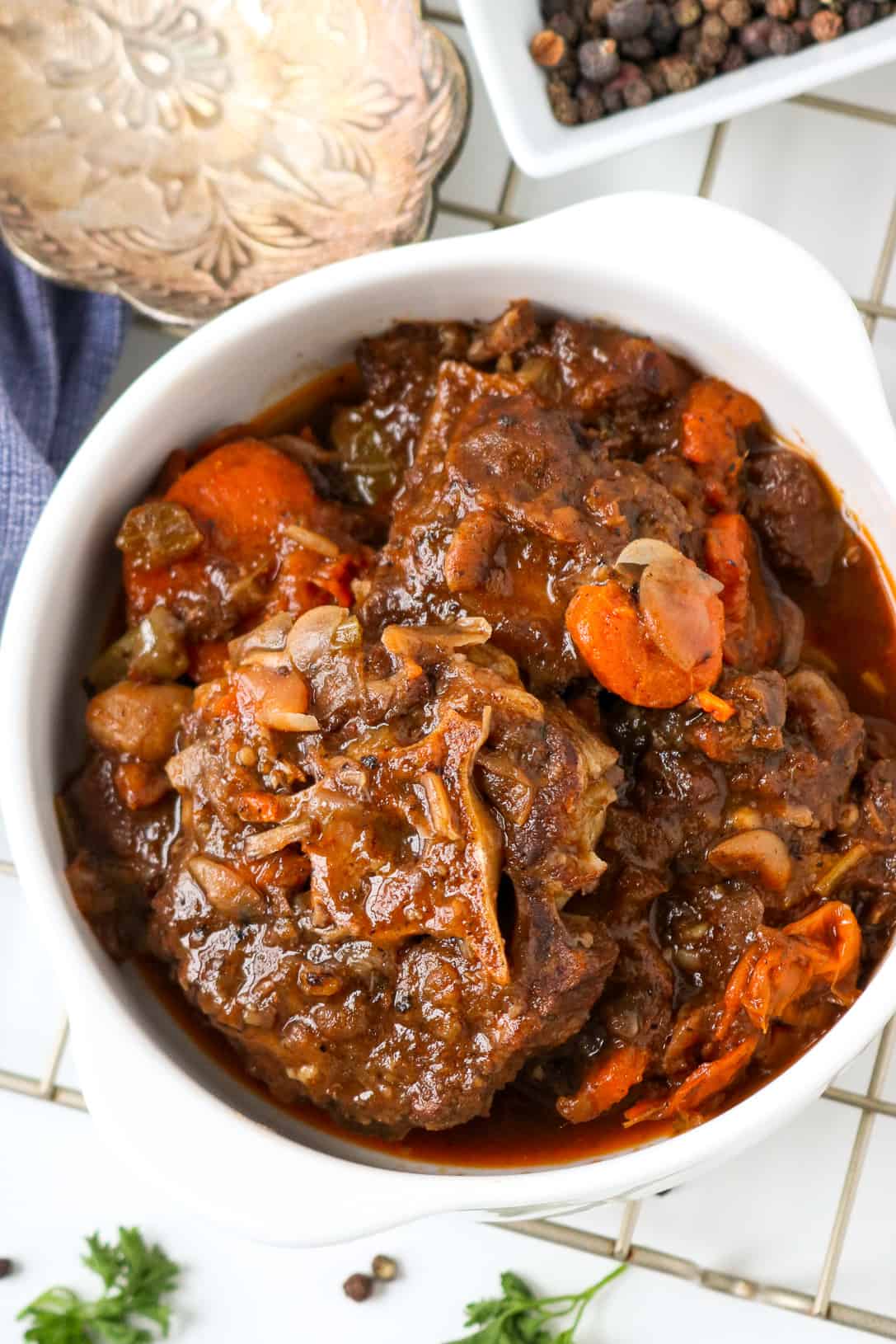 Oxtail in white bowl with carrots