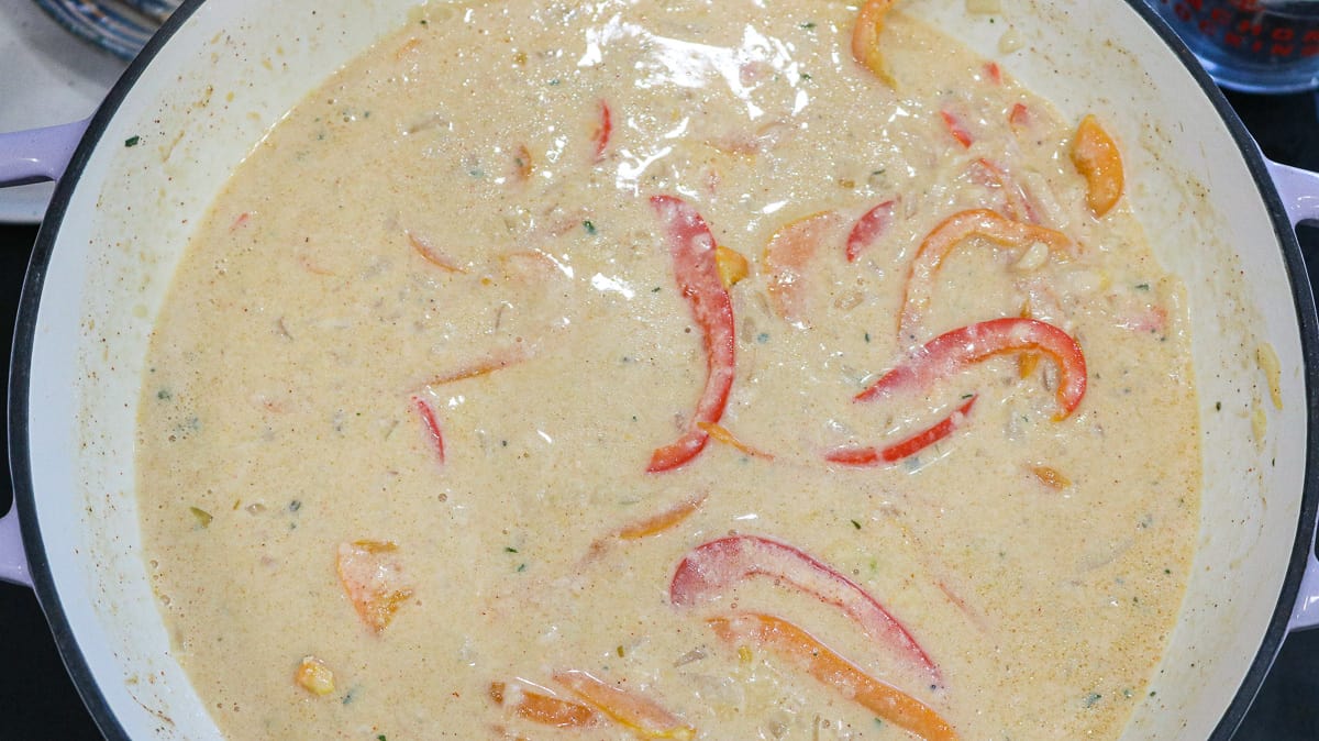 sauce with peppers in pan