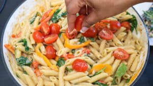 Tomatoes on top of pasta