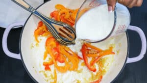 adding milk to sauce