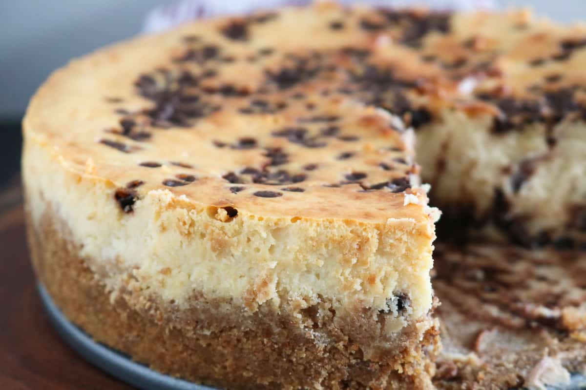 closeup picture of cheese cake with cutout piece