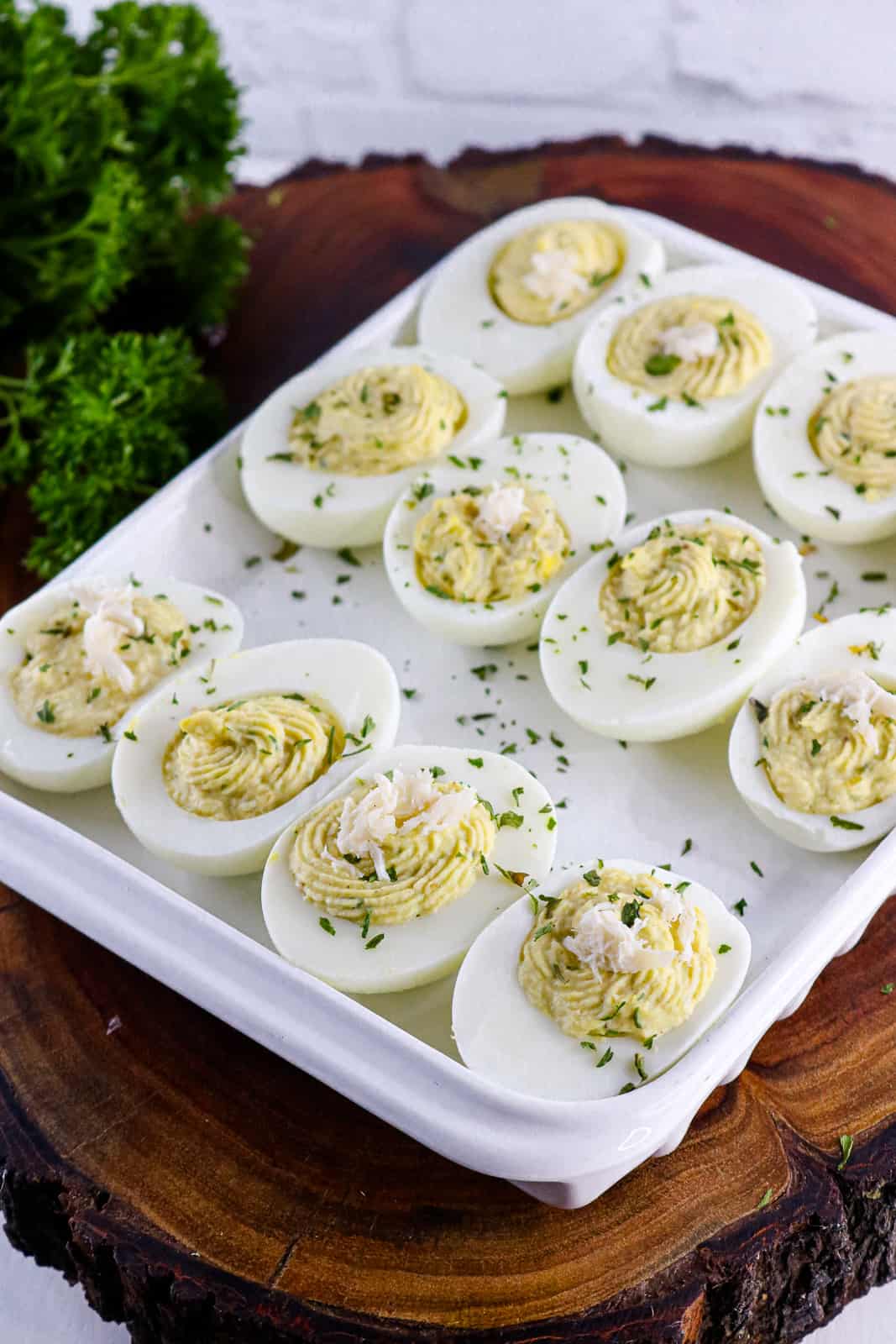 eggs on white tray filled with topping and crabmeat