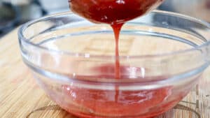 fruits liquid straining into bowl