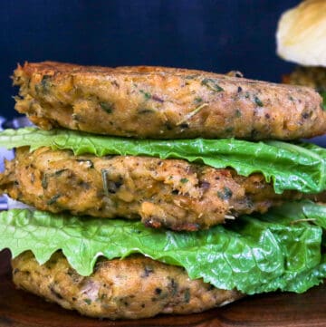 burgers stacked on top of each other with lettuce in between