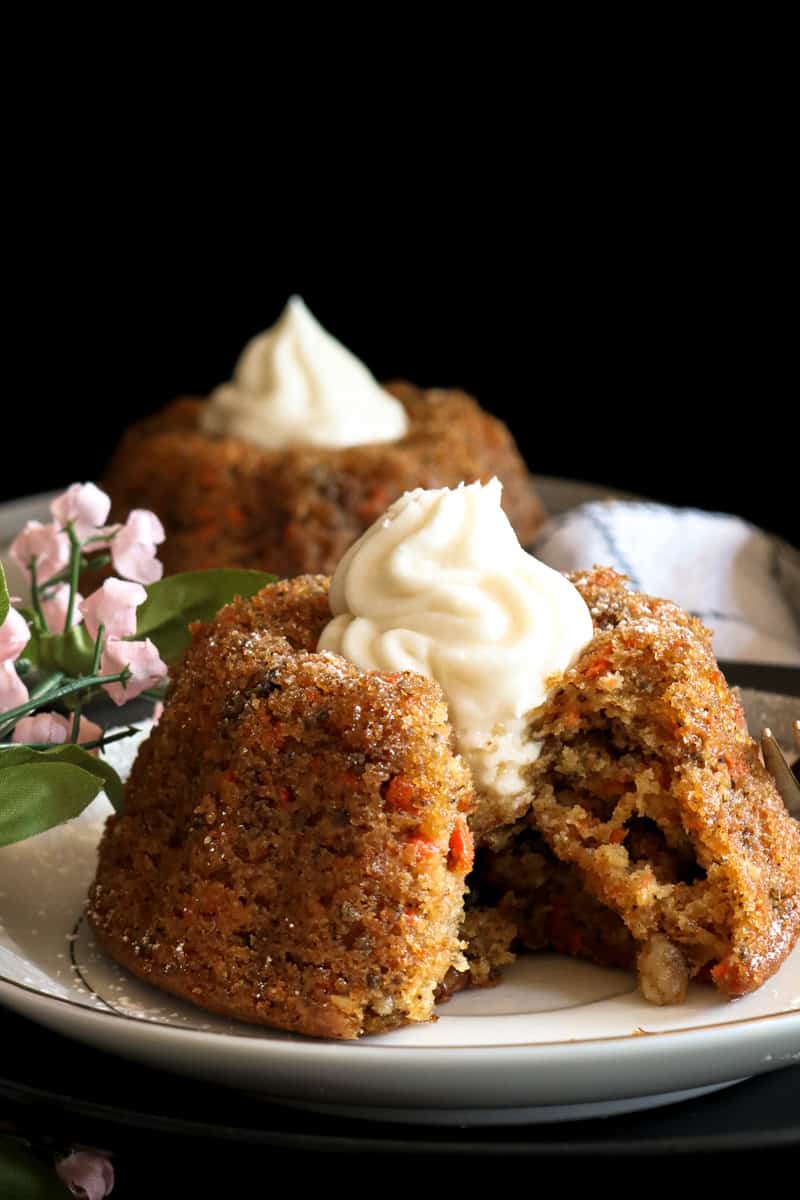 cutout dairy free carrot cake on white plate