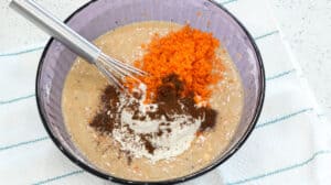 batter with carrots, cinnamon, and cloves with flour