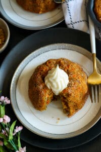 overhead picture of cutout dairy free carrot cake on white plate with fork
