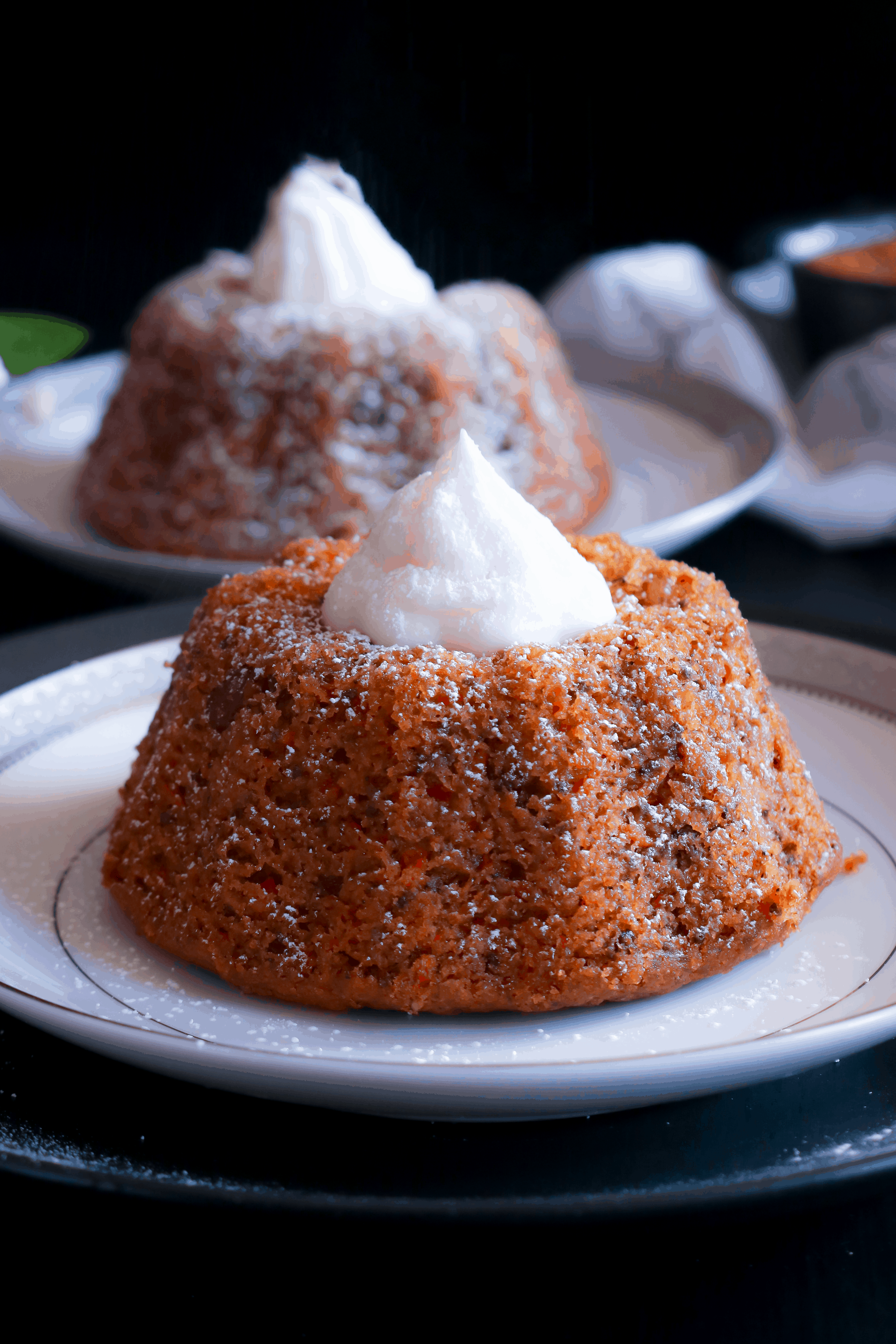 closeup picture of dairy free carrot cake with frosting