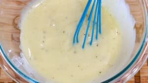 Creamy dressing in glass bowl