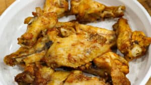 cooked wings in white bowl