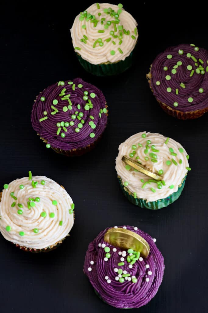 Irish cream cupcakes on black board with coins inserted