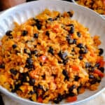 closeup picture of rice and beans in white bowl