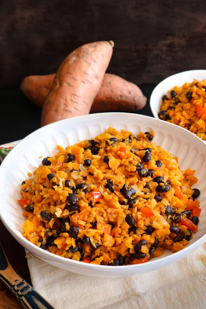 sweet potato rice in white bowl with black beans