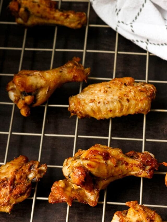 instant pot air fryer chicken wings on rack with kitchen napkin