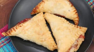 strawberry turnovers on black plate