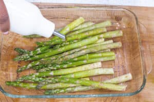 olive oil drizzled over asparagus