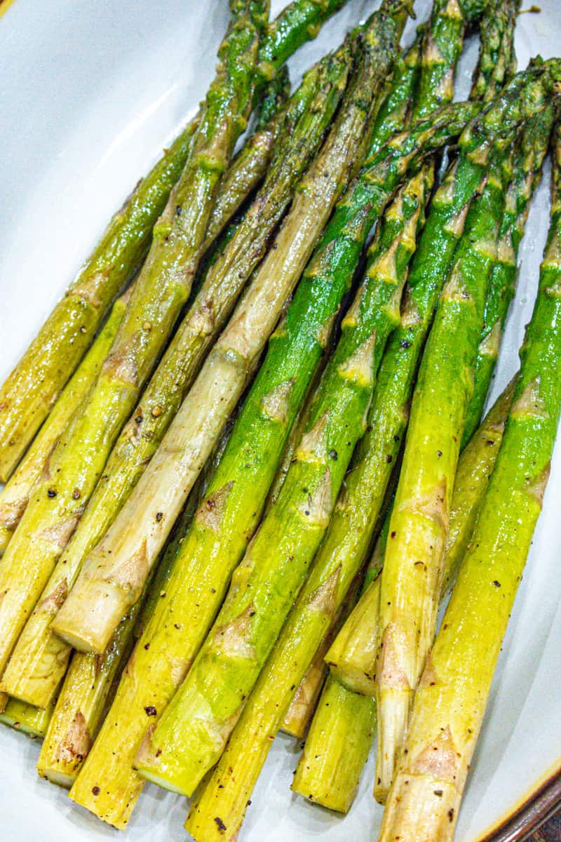 Cooked Air fryer asparagus in white bowl