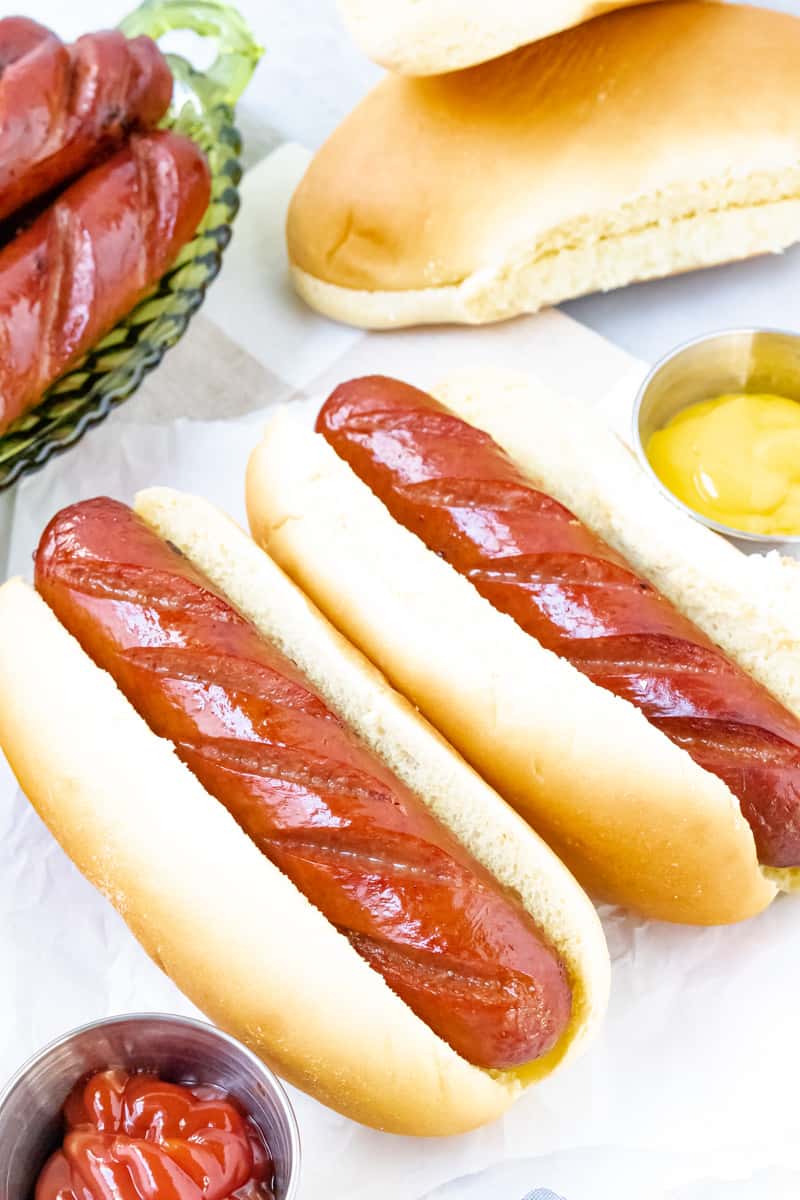 vertical view of two Beef franks in buns