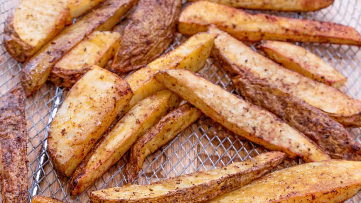 Potato wedges in air fryer basket
