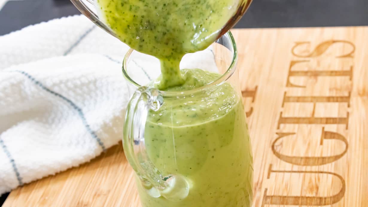 dressing being poured in jar