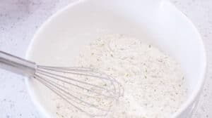 flour in white bowl with seasoning
