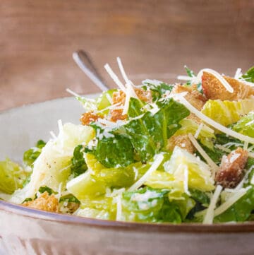 Caesar salad recipe with fork in the bowl