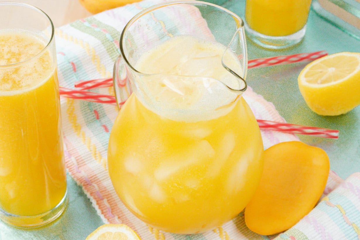 Mango lemonade in glass pitcher
