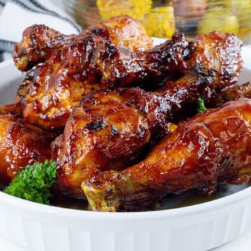 cooked bbq air fryer poultry in white bowl with parsley