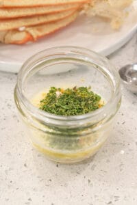 parsley and butter in glass bowl