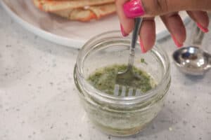 stirring garlic butter sauce