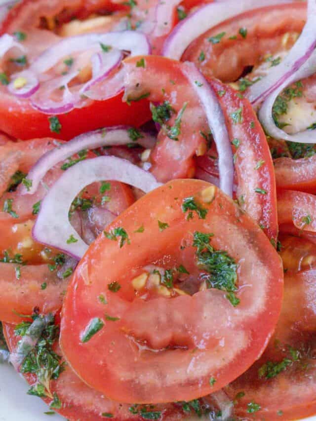 tomatoes and onions in white plate