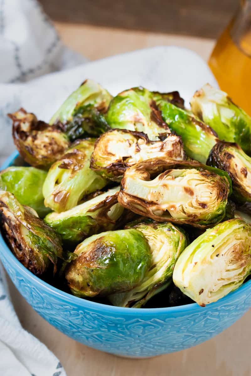 Crispy Air Fryer Brussels Sprouts in blue bowl