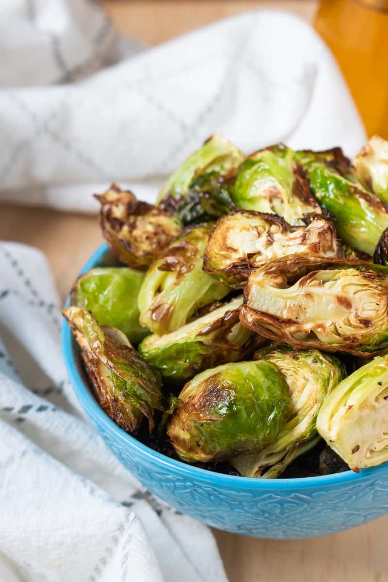 Crispy Air Fryer Brussels Sprouts in blue bowl