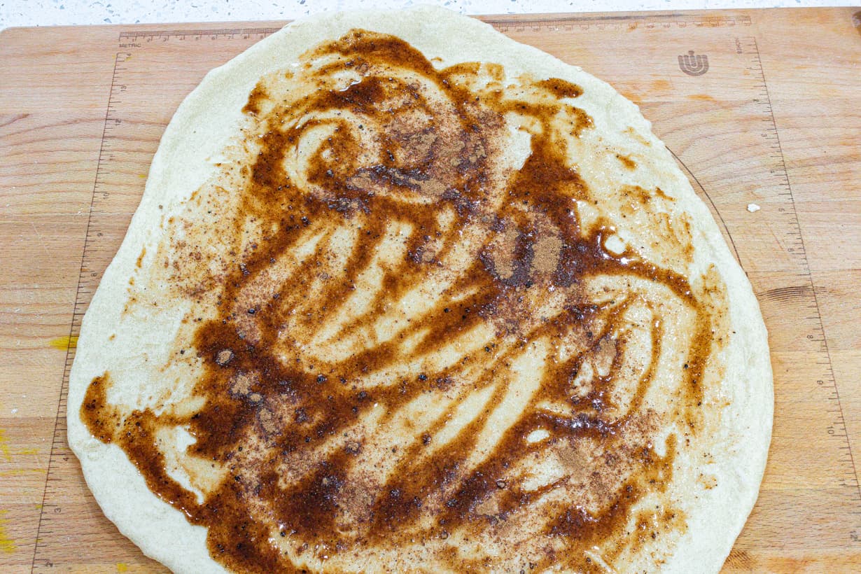 cinnamon sugar spread on dough