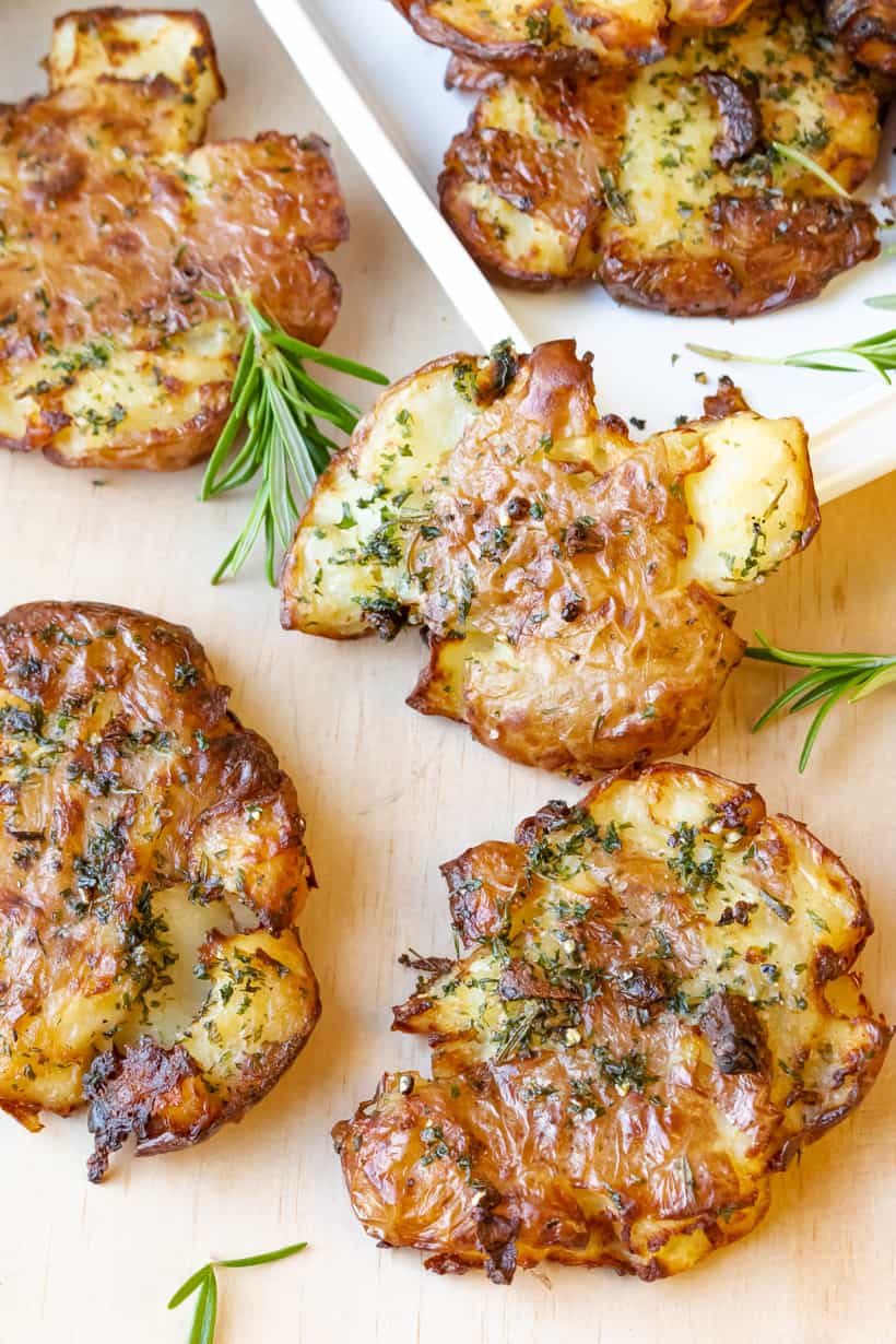 potatoes on board with rosemary