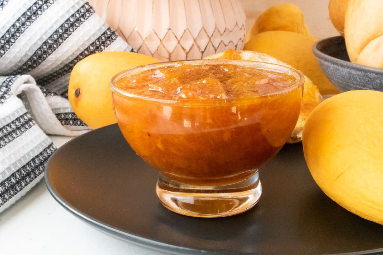 mango jam in glass jar.