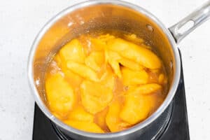 mango with mixture in saucepan