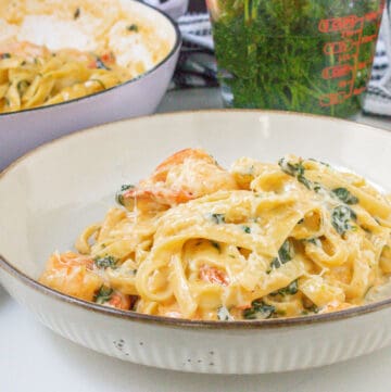 shrimp and spinach Alfredo on plate