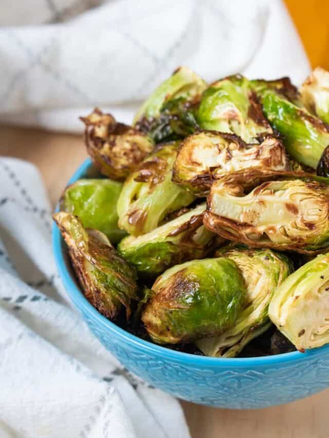 Crispy Air Fryer Brussels Sprouts in blue bowl