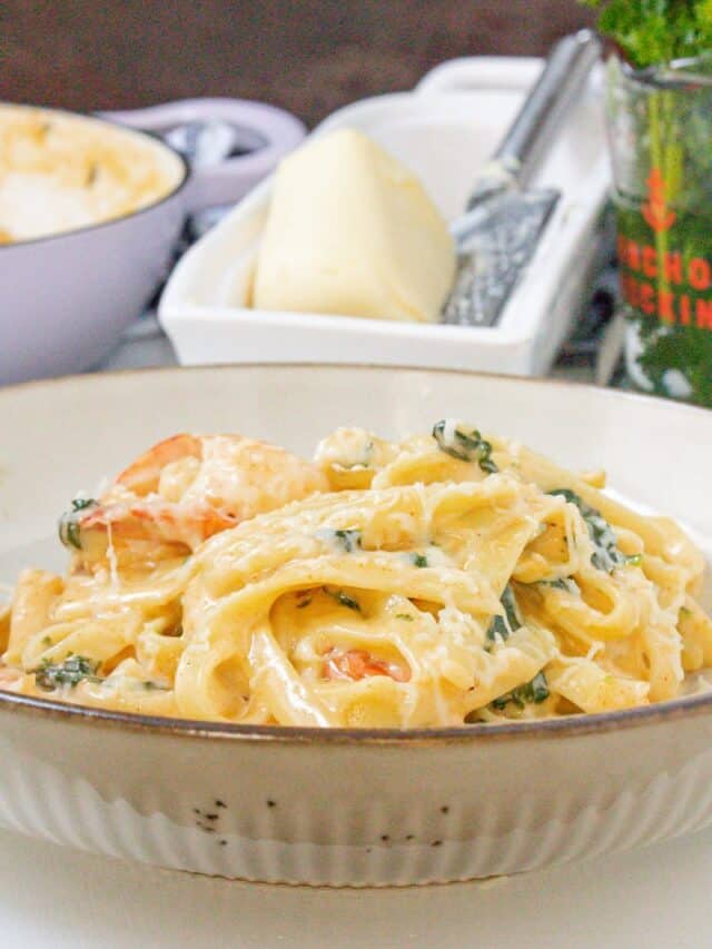 pasta topped with cheese on plate