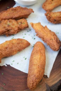 Haitian Appetizer on a wooden board lined with parchment paper