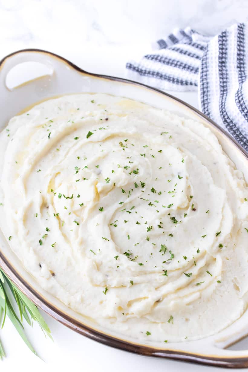 Sour Cream mashed potatoes in bowl with dish towel