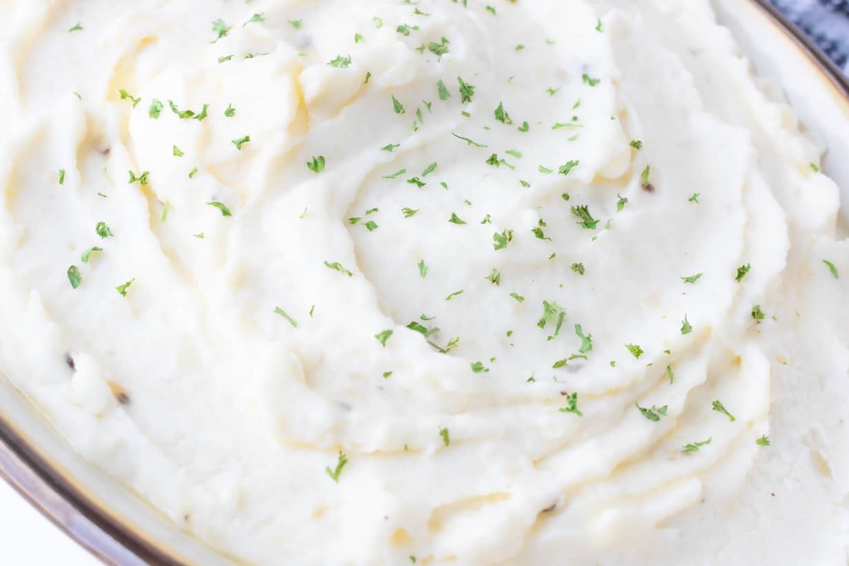 sour cream mashed potatoes topped with fresh herbs