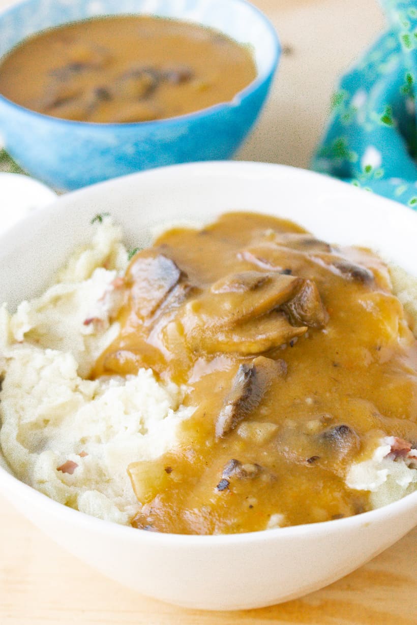 egan Mushroom Gravy over mashed potatoes in a white bowl