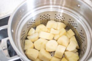 potatoes in steamer pot basket