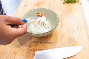 hand holding pepper flakes