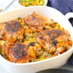cooked chicken and rice in white baking dish