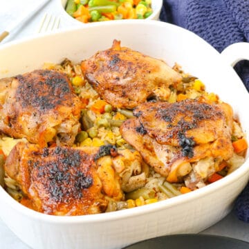 cooked chicken and rice in white baking dish