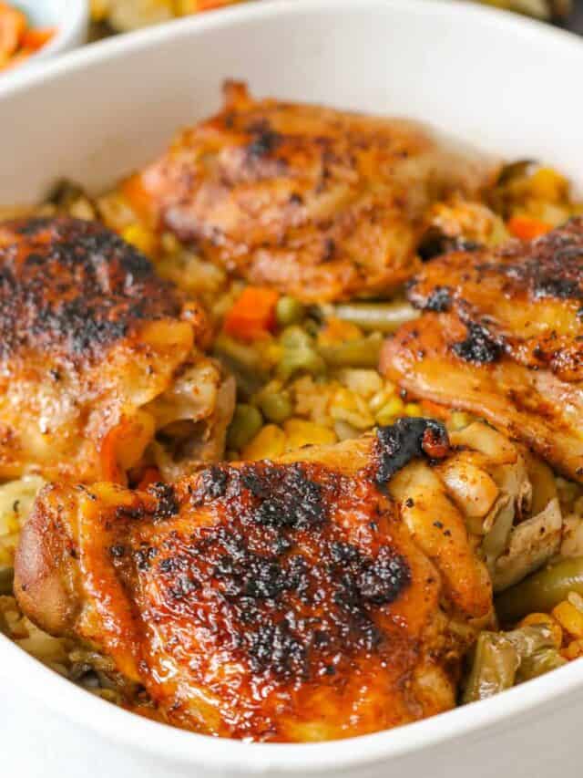 cooked chicken and rice in white baking dish